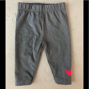 Nike dry-fit leggings with hot pink nike sign. 6-9